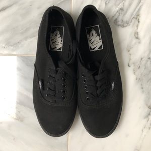 Black Vans sneakers